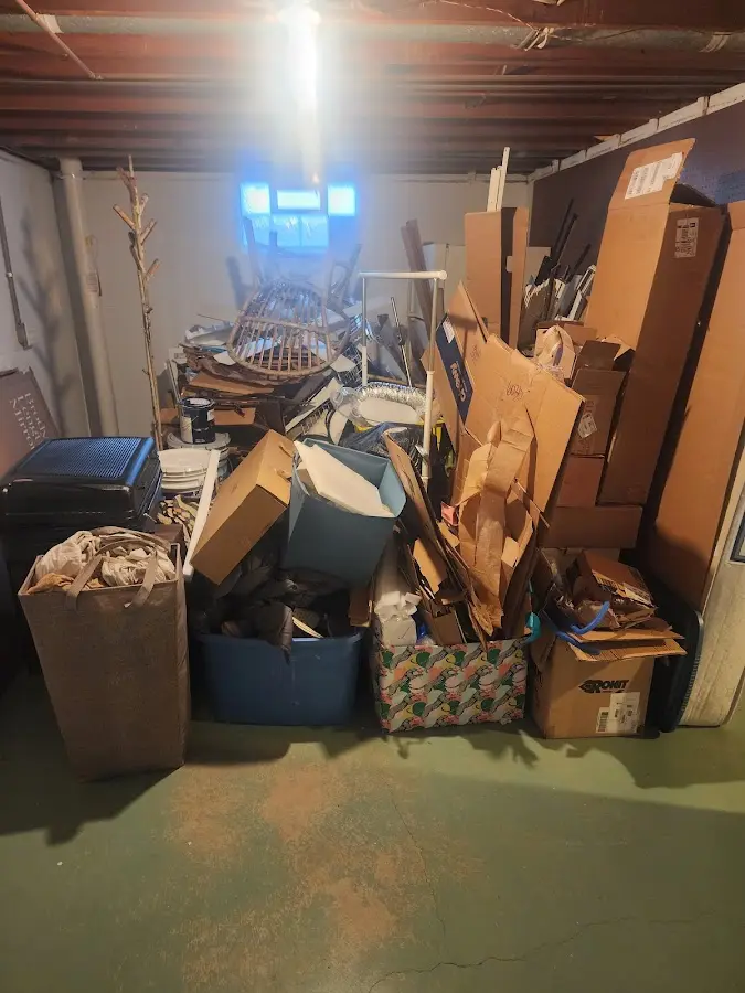 Roll-off dumpster container at job site for 15 Yard Dumpster Rental in Rush